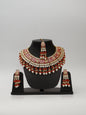 Red Meenakari Kundan & Pearl Necklace Set with Earrings & Mang Tikka. - UrbanNest Co