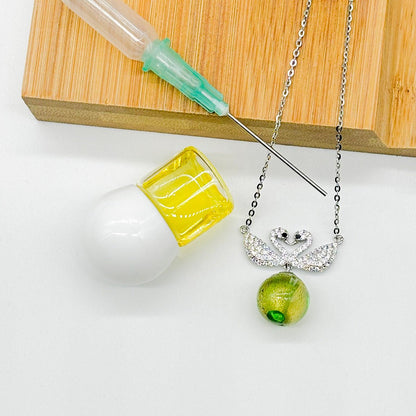 Sterling Silver Twin Swan Aroma Necklace - Gold Green | Energy & Healing | Diffuse on the go - UrbanNest Co
